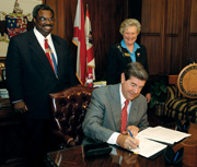 Gov. Bob Riley signing order to form an executive commission, which will create more accountability for the Black Belt project/Photo courtesy of Alabama Governor's Office